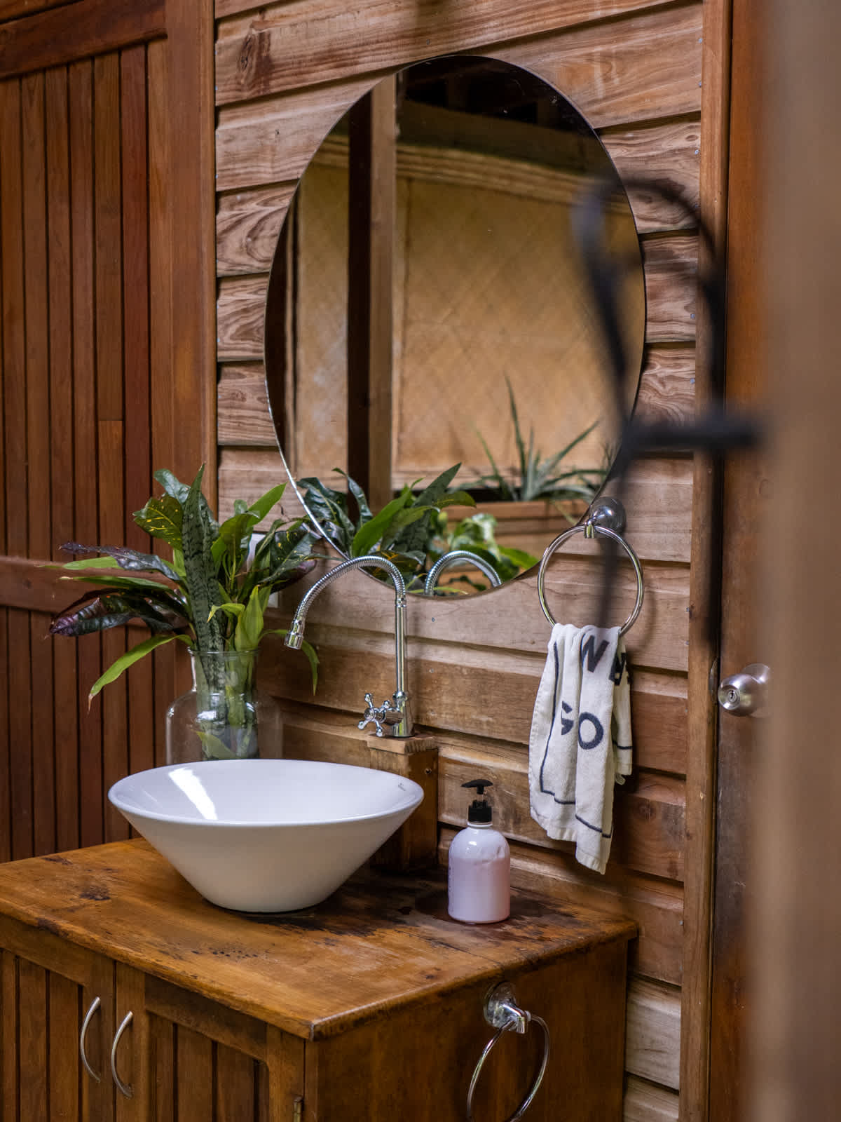Bathroom with a white vessel sink on a wood vanity