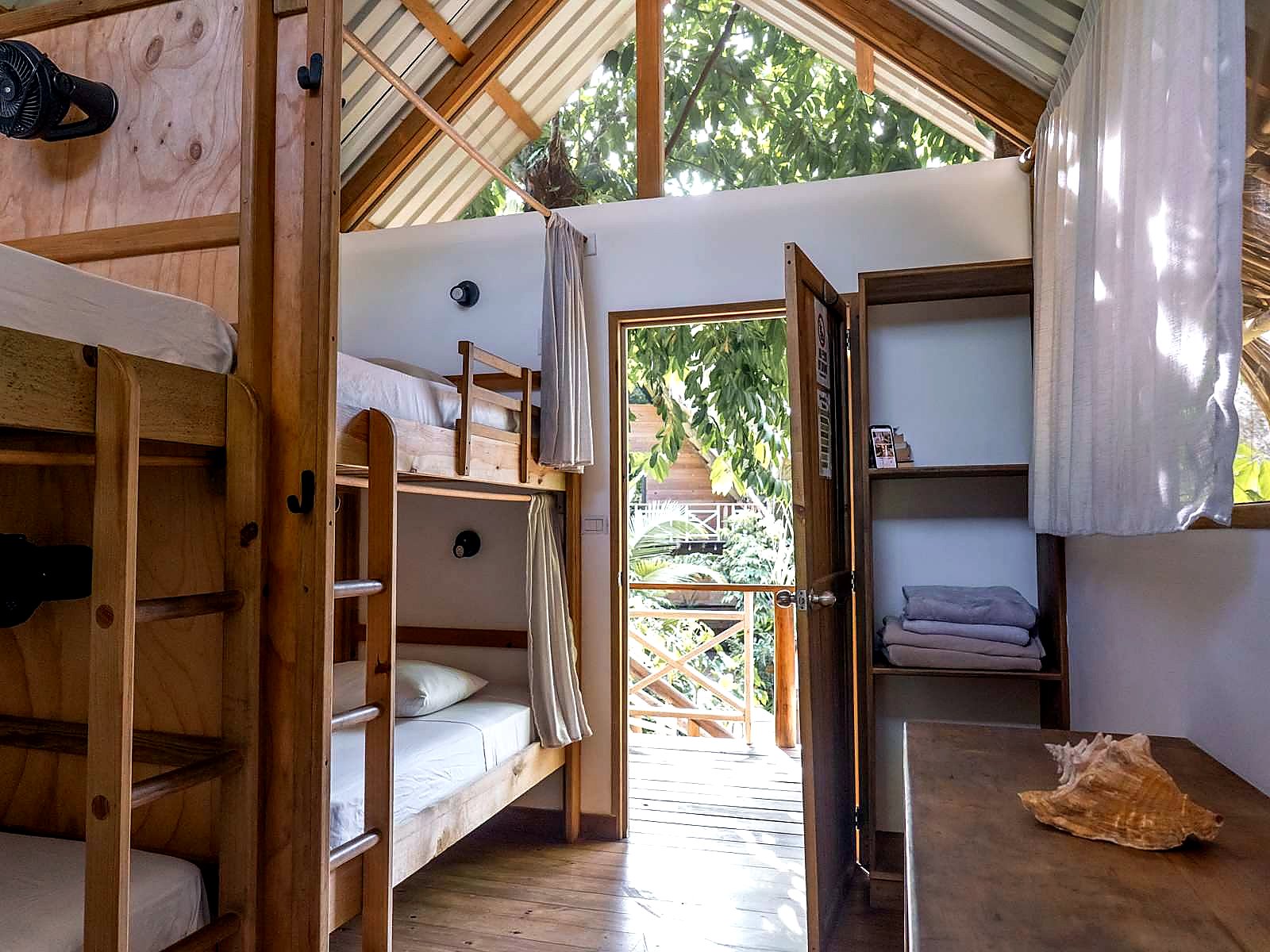 Mixed Dorm bunks with a view into the trees