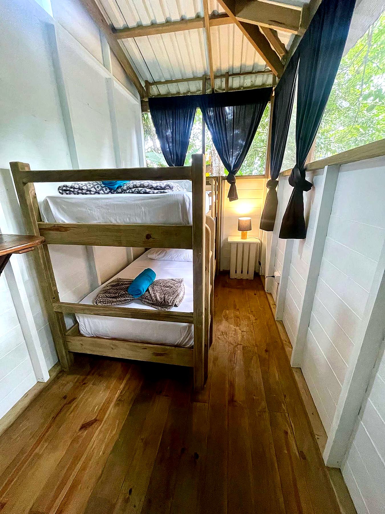 Room 12 bunks with a bedside lamp